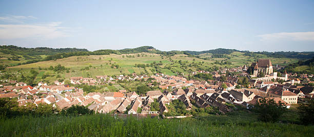 istock Rural landscape with village at sunset 613227602