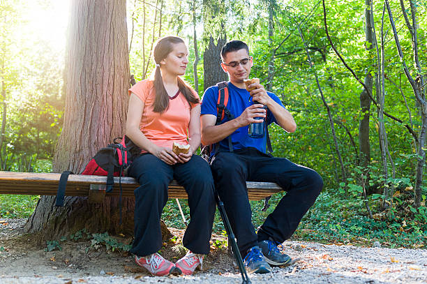 istock Couple resting during hiking in forest 613228624