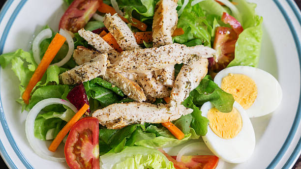 istock Roast chicken with boiled egg salad. 613229524