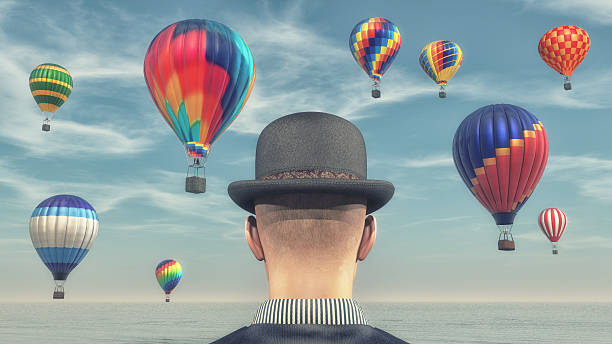 istock Man looks at hot air balloons 613229636