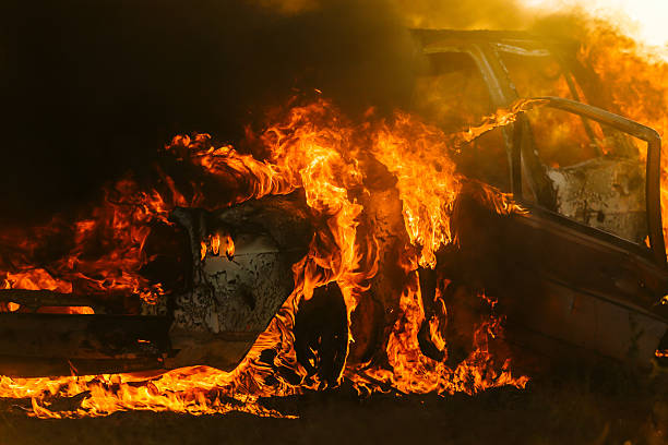 Car covered in flames with doors ripped open