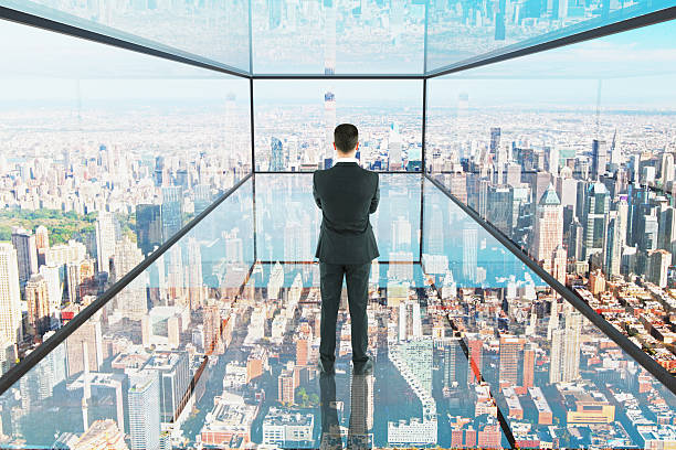 istock Thoughtful businessman in glass room 613230622