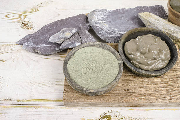 istock Ancient minerals green clay powder and mud mask for spa 613232512