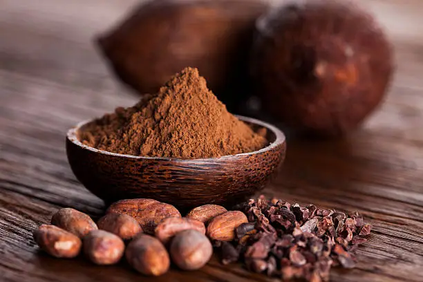 Photo of Cacao beans and powder and food dessert background