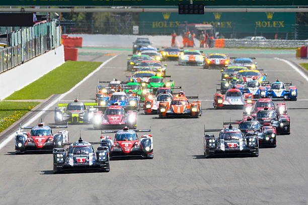 Spa, Belgium - May 7, 2016: Race start of the 2016 Six Hours of Spa of the FIA World Endurance Championship at the Spa-Francorchamps race track. The Porsche 919 Hybrid race cars are leading the Toyota TS050 and Audi R18 LMP1 cars in front of the rest of the field of LMP and LM GTE race cars. The car is driving around the Spa Francorchamps race track during the WEC 6 Hours of Spa-Francorchamps. The team participates in the 2016 FIA World Endurance Championship (WEC).