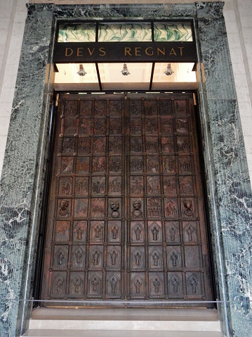 Benevento, Campania, Italy - September 30, 2016: the Janua Maior, the extraordinary port dating from the late twelfth century bronze and considered one of the most important medieval artistic expressions of southern Italy, located in the church, in the entrance vestibule, as a gateway to the nave in December 2012, after a long and meticulous restoration. Before the 1943 bombings, which reduced it to fragments, the door was placed in front where it was replaced with a full copy, also in bronze.