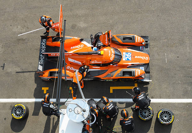 G-Drive Racing Oreca 05 - Nissan pit stop Spa, Belgium - May 7, 2016: Pit stop for the G-Drive Racing Oreca 05 - Nissan LMP2 race car during the Six Hours of Spa Francorchamps. Mechanics are re-fuelling the car and ready to change the tyres once fuelling has finished. The car is driving around the Spa Francorchamps race track during the WEC 6 Hours of Spa-Francorchamps. The team participates in the 2016 FIA World Endurance Championship (WEC). pitstop stock pictures, royalty-free photos & images