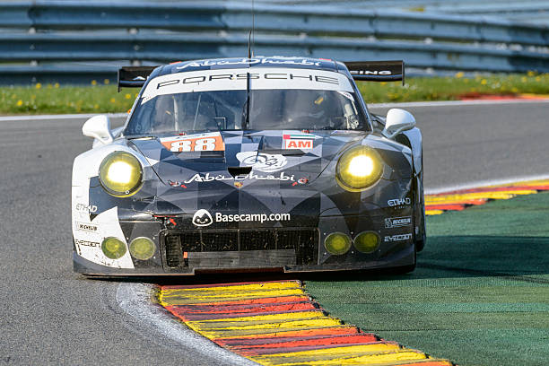 Spa, Belgium - May 7, 2016: Abu Dhabi Proton Racing Porsche 911 RSR driving through Les combes during the WEC Six Hours of Spa Francorchamps. The car is driving around the Spa Francorchamps race track during the WEC 6 Hours of Spa-Francorchamps. The team participates in the 2016 FIA World Endurance Championship (WEC).