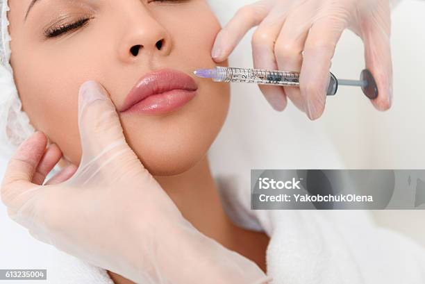 Professional Cosmetologist Making Facial Injection Stock Photo - Download Image Now - Botulinum Toxin Injection, Human Lips, Injecting