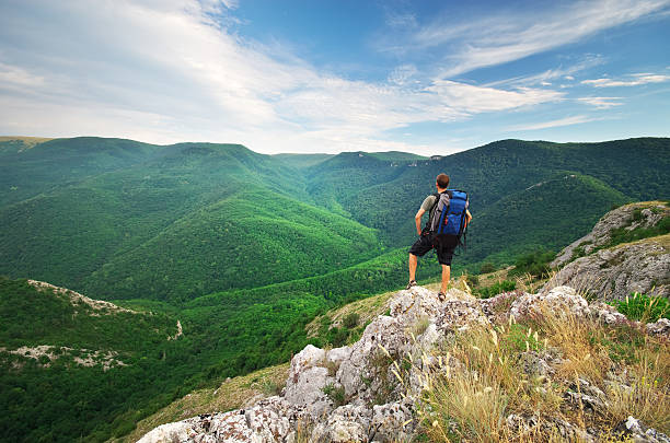 istock Man tourist in mountain 613236740
