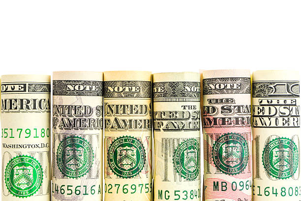 istock rolls of american dollar banknotes in one row 613236974
