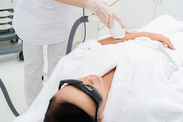 istock Professional cosmetologist doing ultrasound massage 613237890