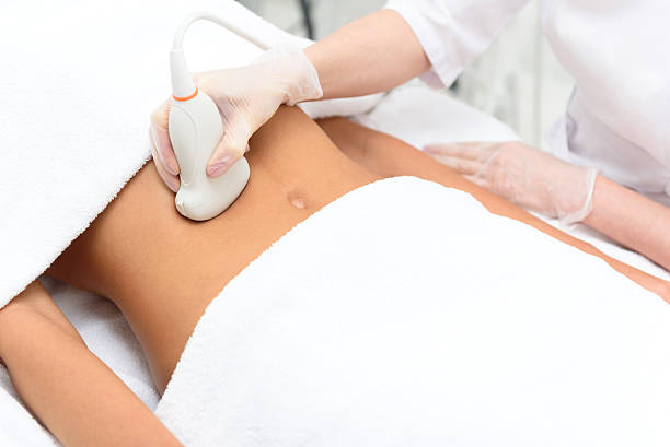 istock Young woman making ultrasonic procedure 613240234