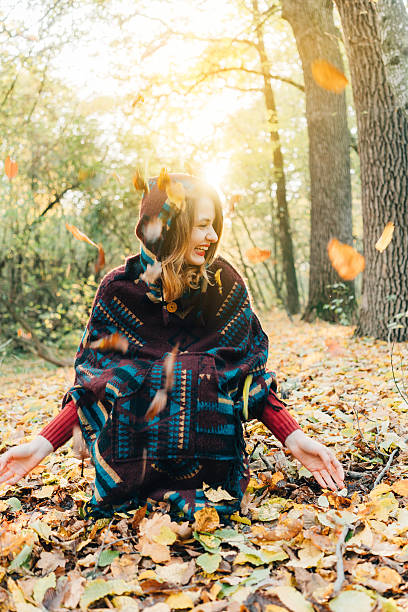 istock Woman in the  autumn forest 613240250