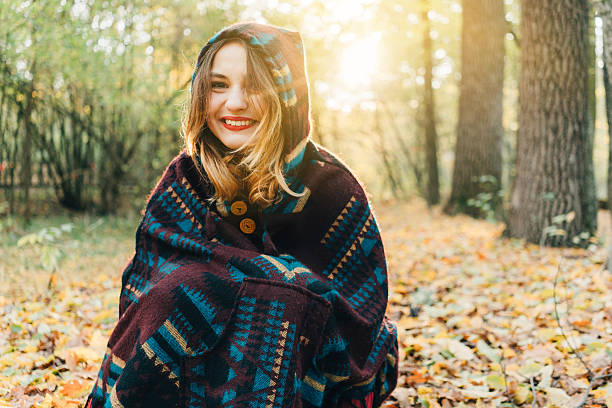 istock Woman in the  autumn forest 613240282
