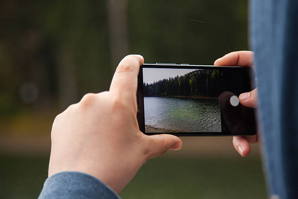 istock Man taking photos on his smartphone 613240754