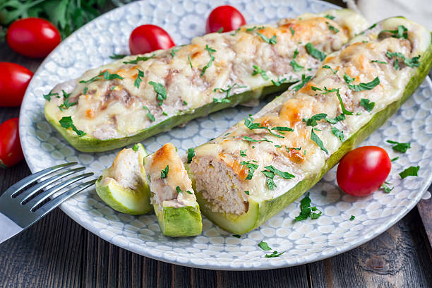 istock Zucchini boats stuffed with ground meet on a plate, horizontal 613241172