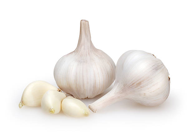 istock Garlics isolated on white background with clipping path 613244172