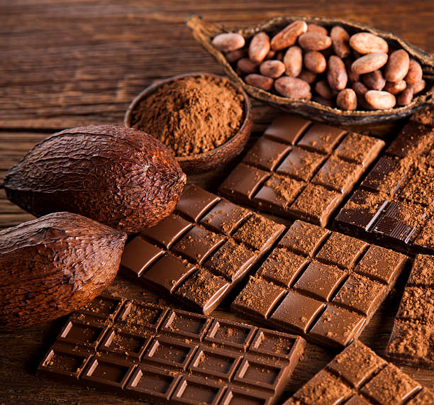 istock Dark and milk chocolate bar on a wooden table 613244666