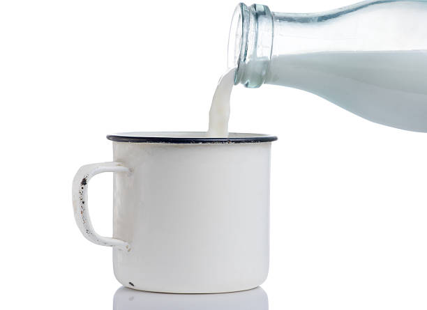 istock Pouring milk in a mug 613245668
