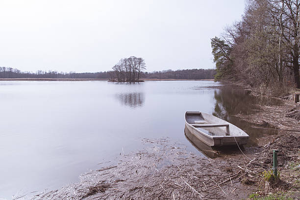 istock The boat moored at the lake shore. 613247546