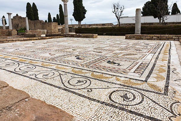 Italica, S. Santiponce, Spain - March 9, 2016: Roman mosaic in Italica (north of modern day Santiponce, 9 km NW of Seville, Spain) is a magnificent and well-preserved Roman city and the birthplace of Roman Emperors Trajan and Hadrian. italica spain stock pictures, royalty-free photos & images
