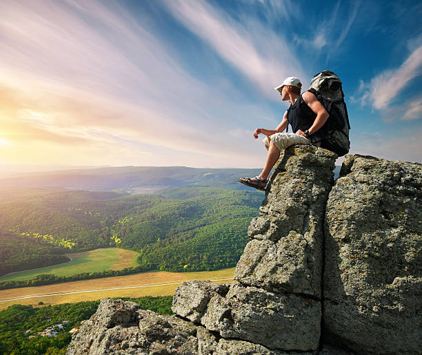 istock Man on peak of mountain 613248208