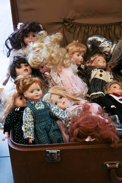 istock suitcase  , old porcelain dolls 613248484
