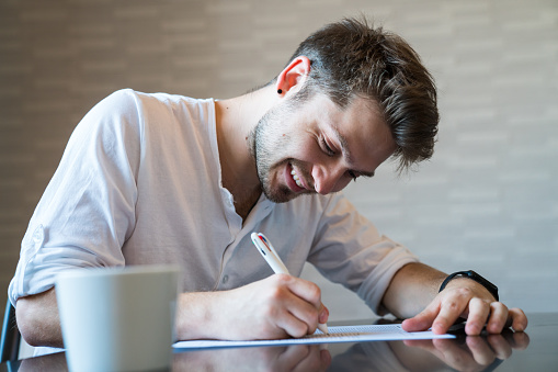 Man filling out important paper documents