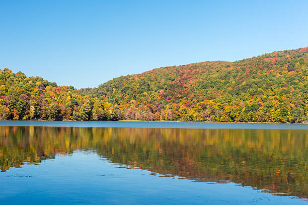 istock Hertel Lake in Quebec, Canada, with Autumn colors 613250620
