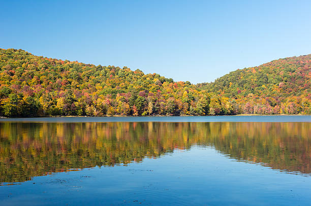istock Hertel Lake in Quebec, Canada, with Autumn colors 613250652