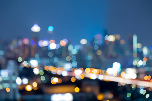 istock Twilight blurred lights Bangkok city office building 613250656