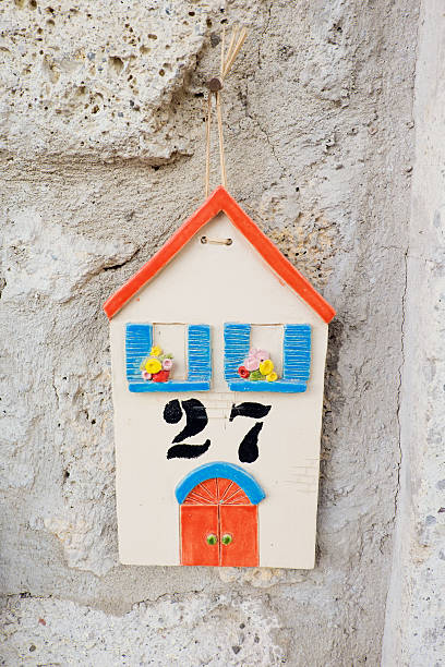 istock House Number 27 is on Wall, Alacati, Turkey 613250904