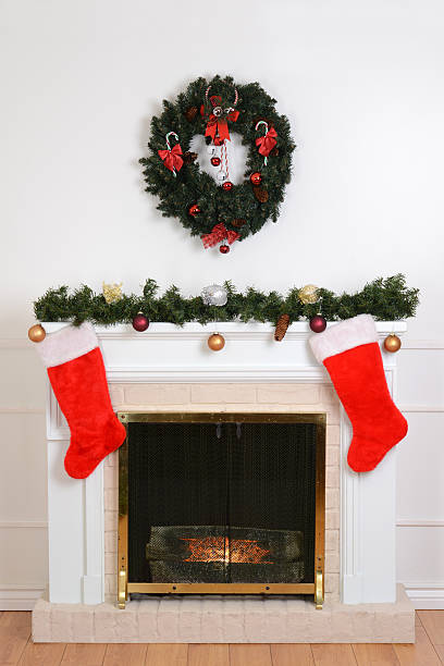 istock christmas fireplace with santa socks 613251468