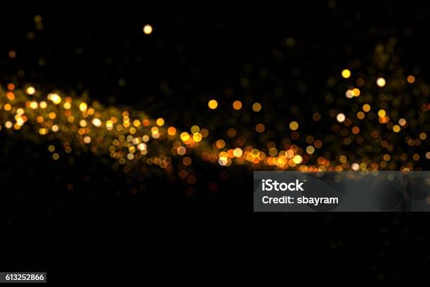 Waving Golden Glitter Stock Photo - Download Image Now - Abstract, Backgrounds, Black Color