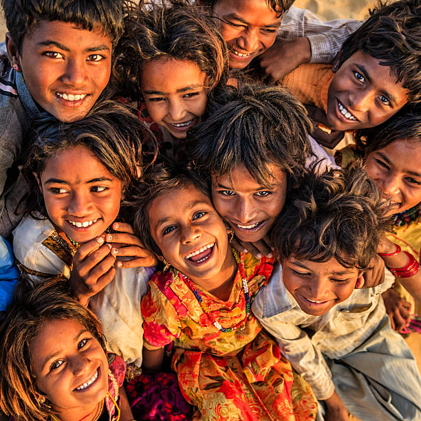Group of happy Gypsy Indian children, desert village, India Group of happy Gypsy Indian children - desert village, Thar Desert, Rajasthan, India. india poverty stock pictures, royalty-free photos & images