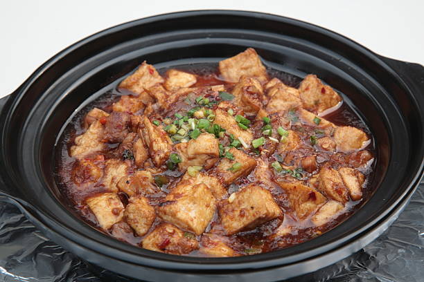 Braed diced chicken, salted fish, and Tofu Clay Pot (salted chicken tofu pot) stock photo