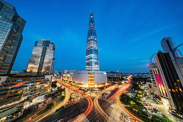Cityscape Songpagu Skyscrapers Lotte World Tower at Night Seoul Cityscape of Songpagu district in Seoul at night. Motion blurred traffic lights, illuminated skyscrapers and Lotte world tower. Seoul, South Korea, Asia. Aerial view with 10 mm ultra wide angle 42 MP Sony A7RII. south korea photos stock pictures, royalty-free photos & images
