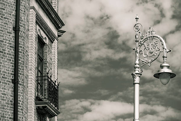 Brick building and a decorated old street light, Dublin, Ireland