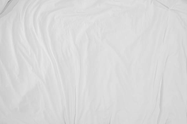 Top view of bedding sheets crease,white fabric wrinkled texture stock photo