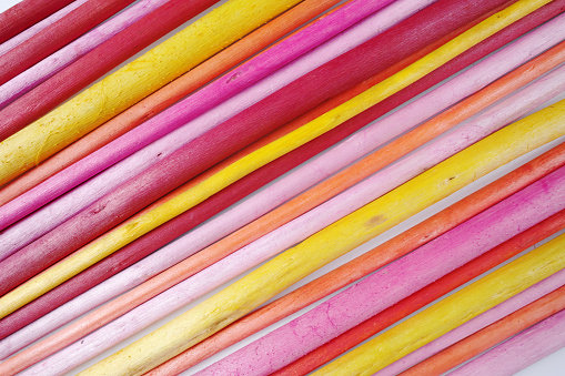 Decorative colorful wooden sticks on white background