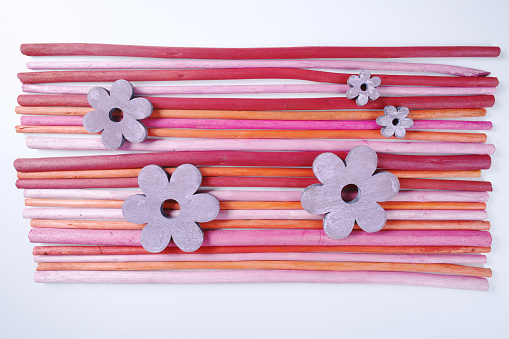 Decorative colorful wooden sticks on white background