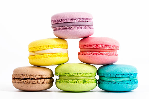 istock Collection of brightly colored French macarons on white background 613302232
