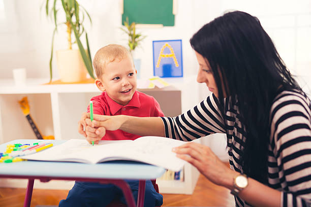 istock Child boy and mother playing with educational toy 613302530