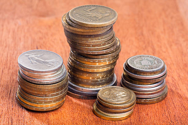 istock stacks of coins on wooden background 613305482