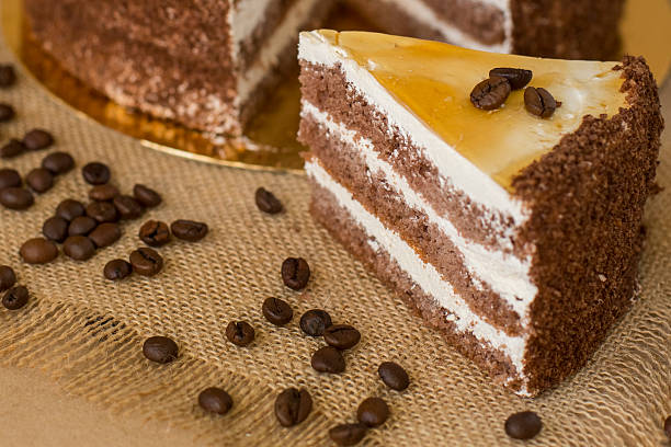 cream puff cake on the table with coffee beans stock photo