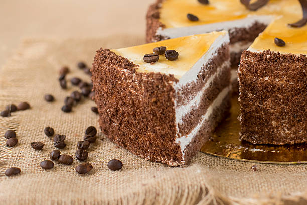 cream puff cake on the table with coffee beans stock photo