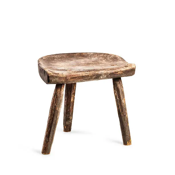 Vintage stool isolated on white background. Antique three legs chair. Single object with clipping path
