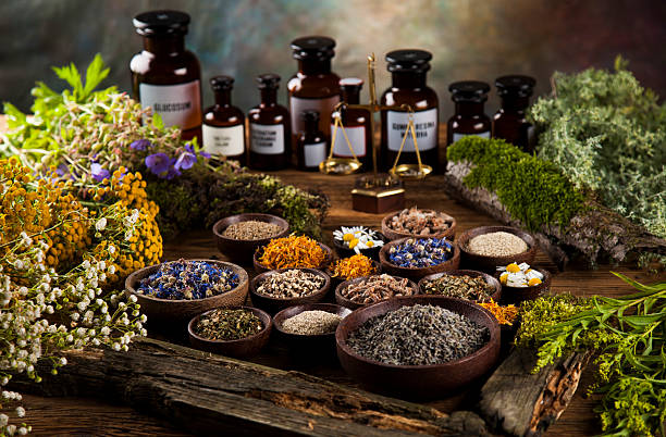 istock Natural medicine on wooden table background 613307180