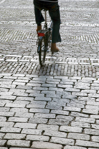 istock Cobblestones and Cyclist, the Hague; Holland 613307444